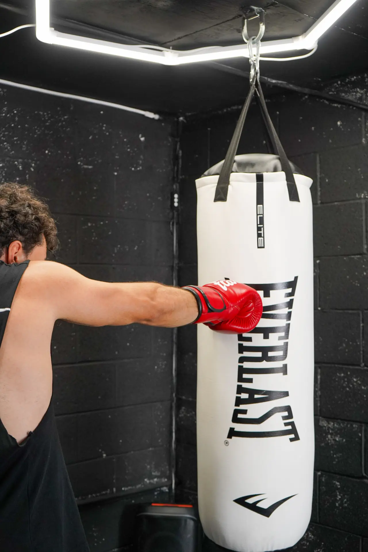 Fighter landing a jab on the heavy bag